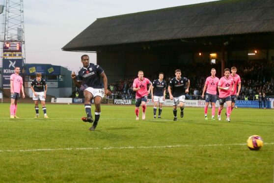 Dundee striker Zach Robinson scores from the spot against Raith Rovers (Image: David Young/Shutterstock).