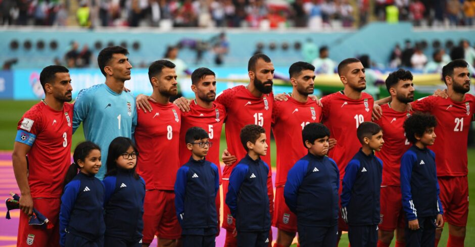 photo shows Iran football team standing for the national anthem ahead of their game against England at the Qatar World Cup.