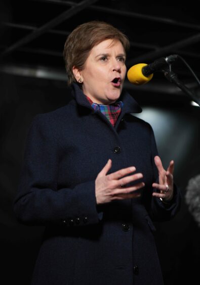 photo shows Nicola Sturgeon speaking into a microphone at the Time for Scotland independence rally in Edinburgh.