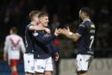 Dundee celebrate after Luke McCowan made it 6-2 against Airdrieonians. Image: David Young/Shutterstock.