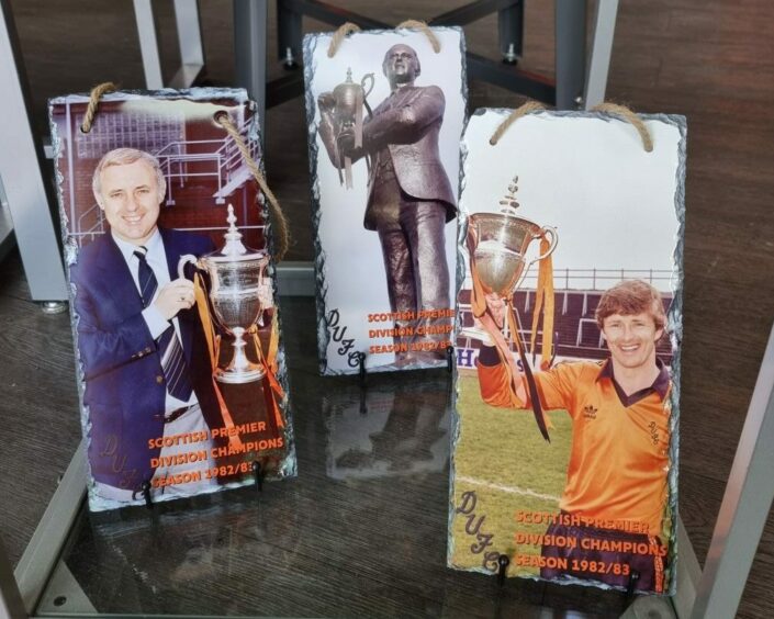 Three slates with pictures from 1983, when Dundee United won the championship.