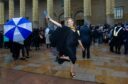 Maxine Cook celebrates their graduation at the Caird Hall in Dundee. Image: Paul Reid