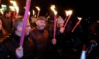 The St Andrews Hooley includes a torchlit parade. Image: Paul Reid.