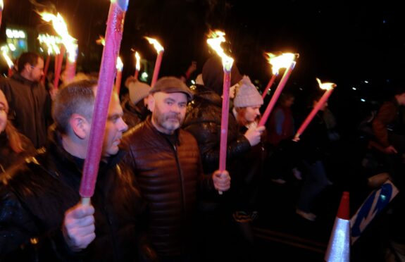 The torchlit parade led The Big Hoolie from South Street, via Bell Street, to the Bruce Embankment. Image: Paul Reid