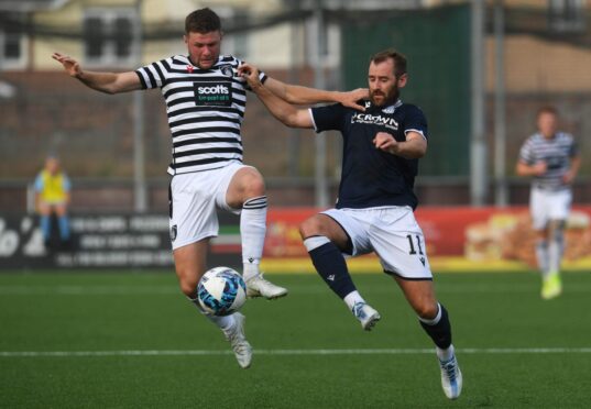Niall McGinn featured for Dundee reserves against Queen's Park. Here he is pictured taking on the Spiders in July. Image: SNS.