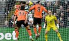 Dundee United star Fletcher's header strikes Celtic's Alexandro Bernabei  on the arm at Celtic Park. Image: Rob Casey/SNS Group