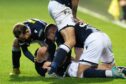 Dundee celebrate against Partick Thistle (Image: SNS).