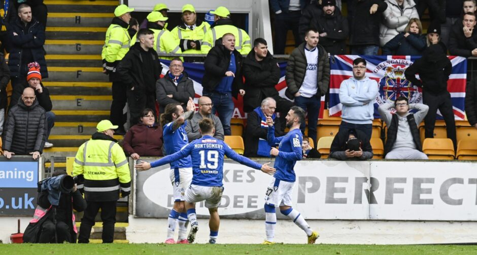Stevie May and Adam Montgomery wait to congratulate Nicky Clark.