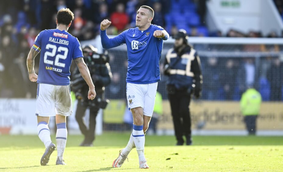 St Johnstone defender Alex Mitchell punches the air after the win.