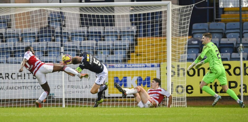 Dundee captain Ryan Sweeney puts his head in where it hurts against Hamilton. 