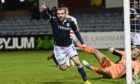 Paul McMullan spins away in celebration after notching for Dundee against Hamilton Accies. Image: SNS.