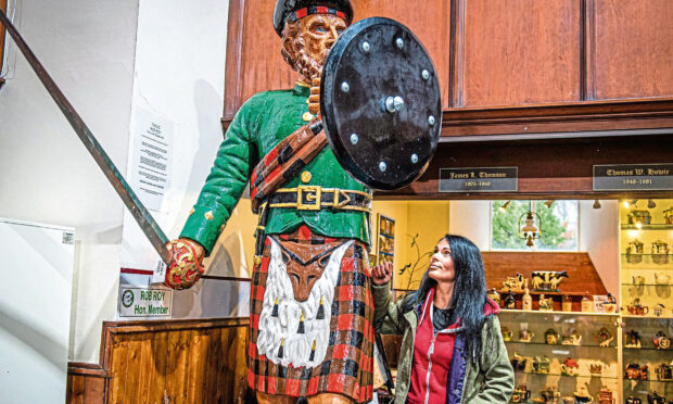 Gayle gazes up at the impressive 9ft 6in Rob Rob statue house in St Peter's Heritage Centre. He's the fifth - of six - statues in Culter. Picture: Wullie Marr.