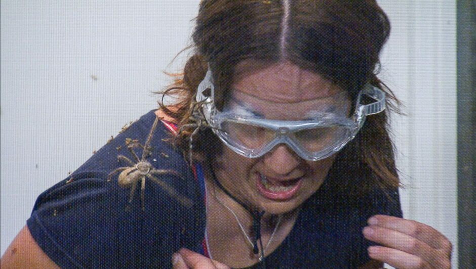 Photo shows Kezia Dugdale grimacing as large spiders crawl over her.