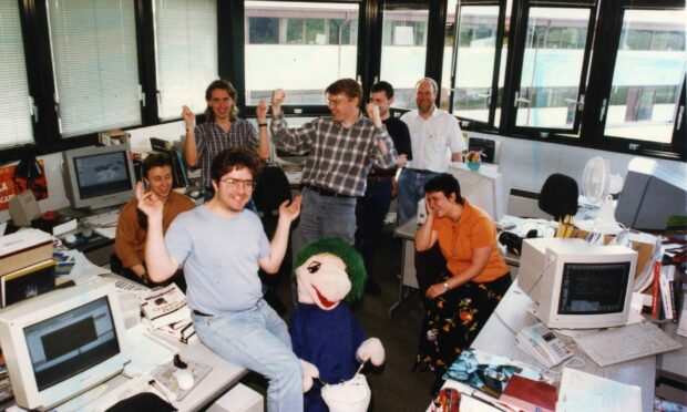 David Jones (centre) and members of the DMA Design team in 1997 before the release of Grand Theft Auto. Image: DC Thomson.