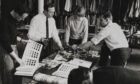 Bernat Klein selecting cloth and yarn samples. Image: National Museums Scotland