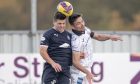 Aaron Comrie challenges for a high ball for Dunfermline Athletic.