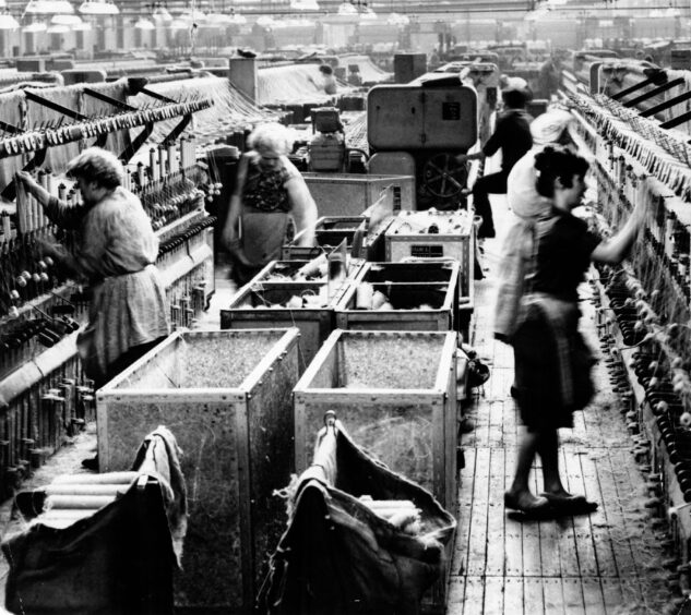 Black and white photo shows women working in the Camperdown Works jute mills in Dundee in 1964.