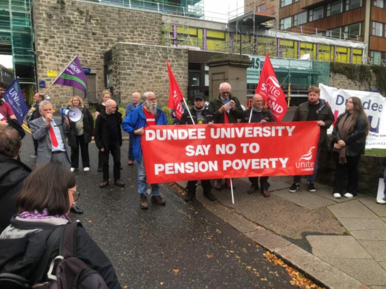 photo shows striking staff holding a banner saying 'Dundee University say no to pension poverty'.