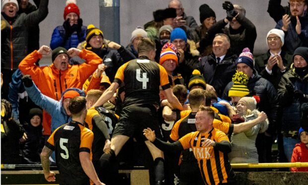 Talbot players and supporters celebrate the winning goal versus Hamilton. Image: SNS.