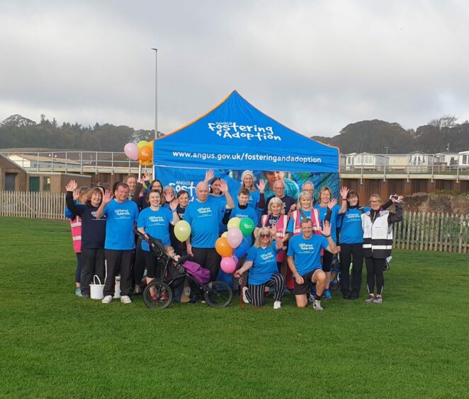 group poses for a photo to encourage people to become a foster carer in Angus 