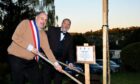 Jean-Christophe Charbit, Mayor of Aulnay-sur-Mauldre (left) and Carnoustie Community Council chairman David Rorie plant a tree to mark the renewal of the twinning charter. Image: Carnoustie Twinning Association.