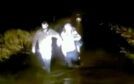 Dundee courier David Aitken helps the woman to safety after she became stranded in a flood.