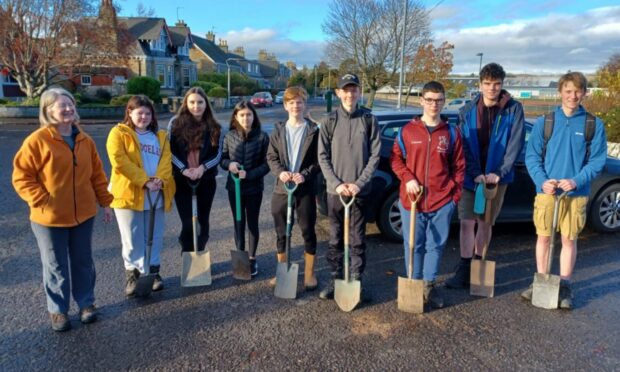 Cupar Explorer Scouts helped Sustainable Cupar volunteers clear out culverts, dig out silt and plant trees up the Moor Road between Cupar and Ceres. Image: Cupar Explorers