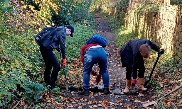 Cupar Explorer Scouts helped Sustainable Cupar volunteers clear out culverts, dig out silt and plant trees up the Moor Road between Cupar and Ceres in November 2022. Image: Cupar Explorers