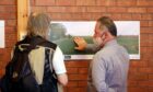 Neil Lindsay from Solar2 chats to a resident at a public consultation event in June 2021. Image: Gareth Jennings/DC Thomson.