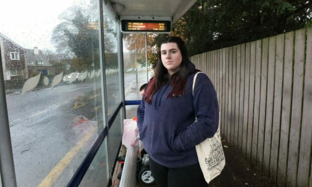 Kaelyn Robertson waiting for her Stagecoach bus home