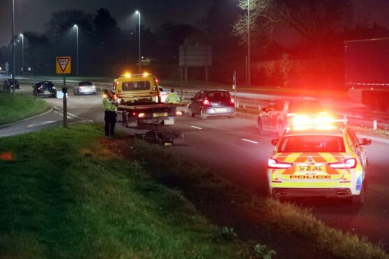 Police at the scene of the motorbike crash on the Kingsway. Image: Gareth Jennings/DC Thomson.