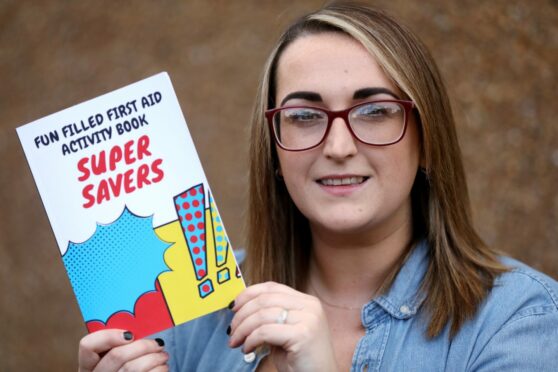 Louise Tyrrell from Carnoustie with her new first aid activity book for children, "Super Savers".