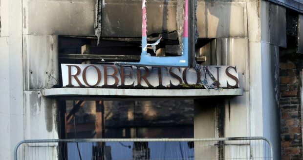 The sign, alongside the white backing, were saved. Image: Gareth Jennings/DC Thomson