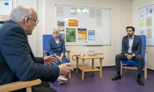 Health Secretary Humza Yousaf speaks with Tom Young and Elizabeth Wood at the rapid cancer diagnostic centre in Victoria Hospital, Kirkcaldy. Picture by Jane Barlow/PA.