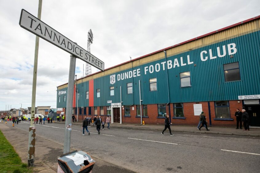 photo shows sign for Tannadice Street, with Dens Park, home of Dundee FC behind it.