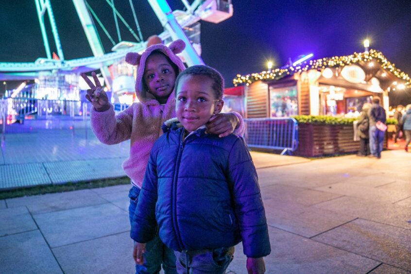 Treasure Olubu, 4, and Daniel Abe, 3, having fun at Winterfest. Image: Kim Cessford/DC Thomson