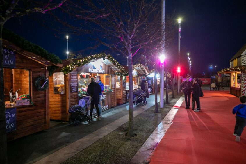 Grabbing  a bite to eat from the food stalls. Image: Kim Cessford/DC Thomson