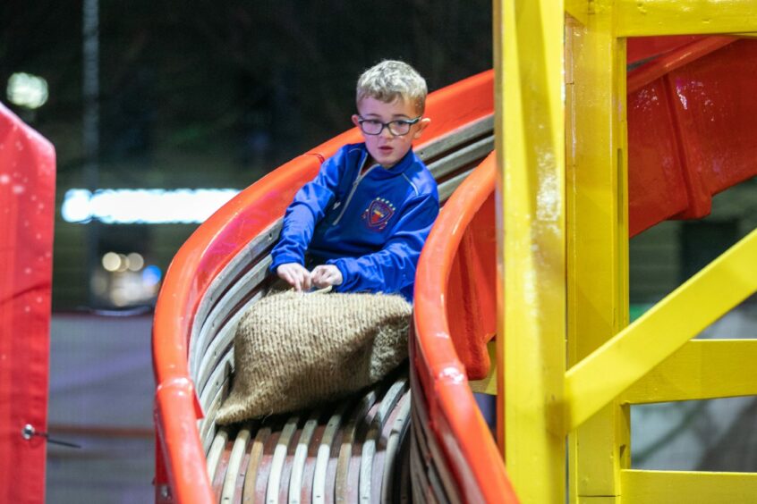 Josh McHugh, 6, on the helter skelter. Image: Kim Cessford/DC Thomson