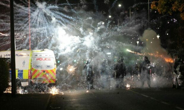 Riot police were called after fireworks were thrown in the Kirkton area of Dundee on Hallowe'en. Picture by Kim Cessford.