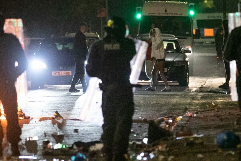 Police with riot shields in Kirkton. Image: Kim Cessford/DC Thomson.