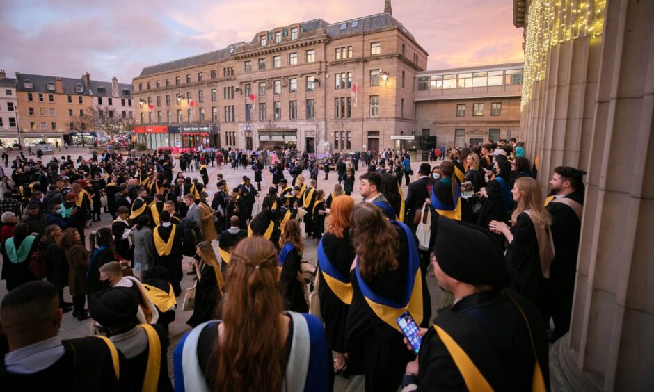 photo shows hundreds of graduating students in gowns in Dundee's City Square.