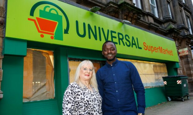 Yusuf Usman and his wife Arlene outside Universal Supermarket on Panmure Street.