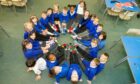 Picture shows the children at St Marie's Primary School showing off their odd socks.
