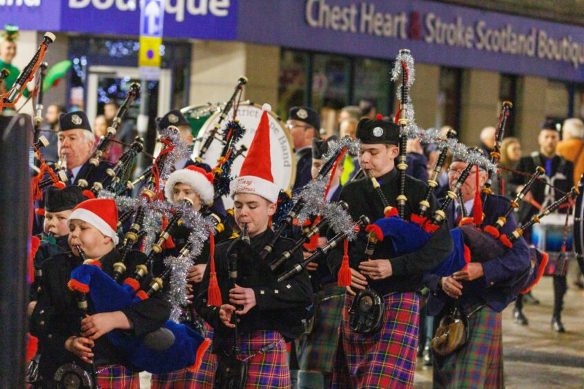 Perth &amp; Kinross Pipe Band lead the parade to Mill street. Image: Kenny Smith/ DC Thomson