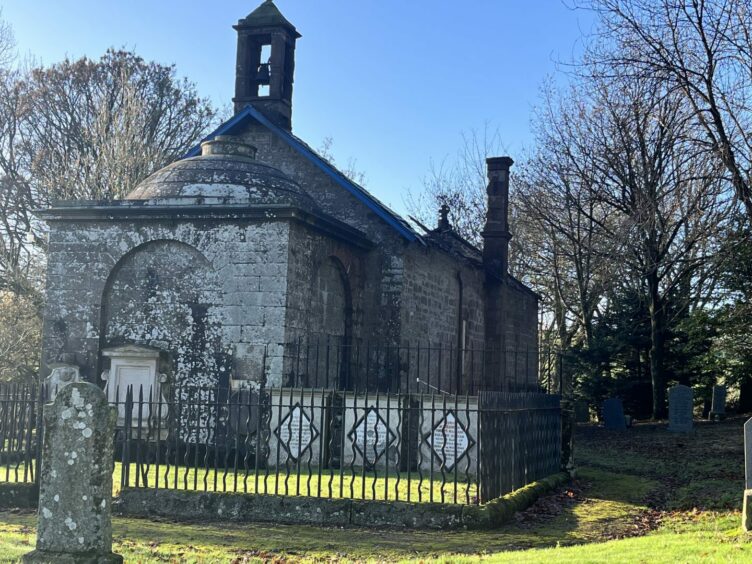 The Duncan mausoleum and family graves at Lundie kirk.