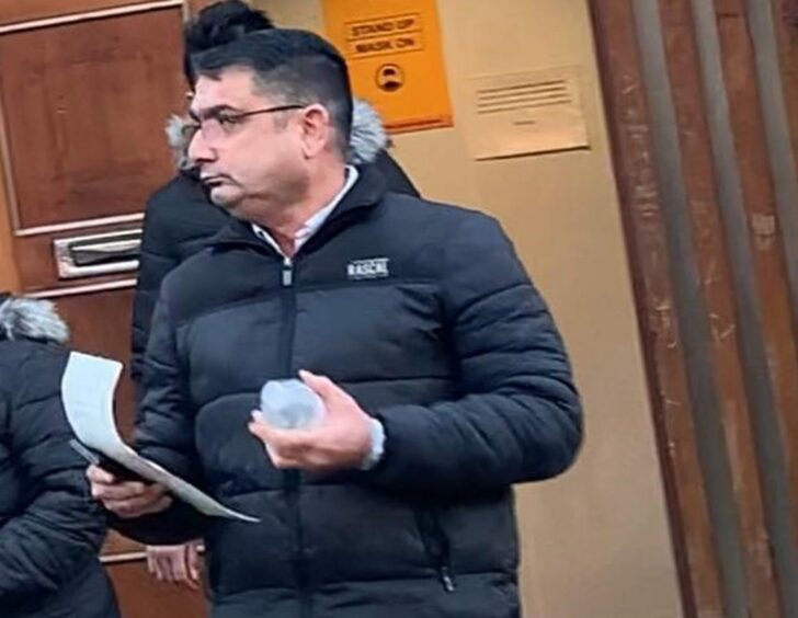 Anstruther shop boss Rajiv Sharma leaves Dundee Sheriff Court after conviction.
