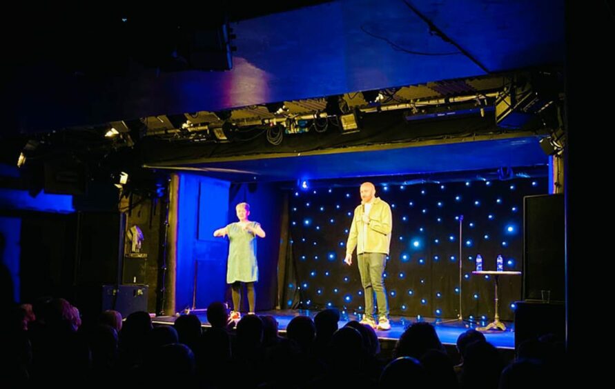Ray with sign language interpreter Karen performing a gig at Oran Mor in Glasgow.
