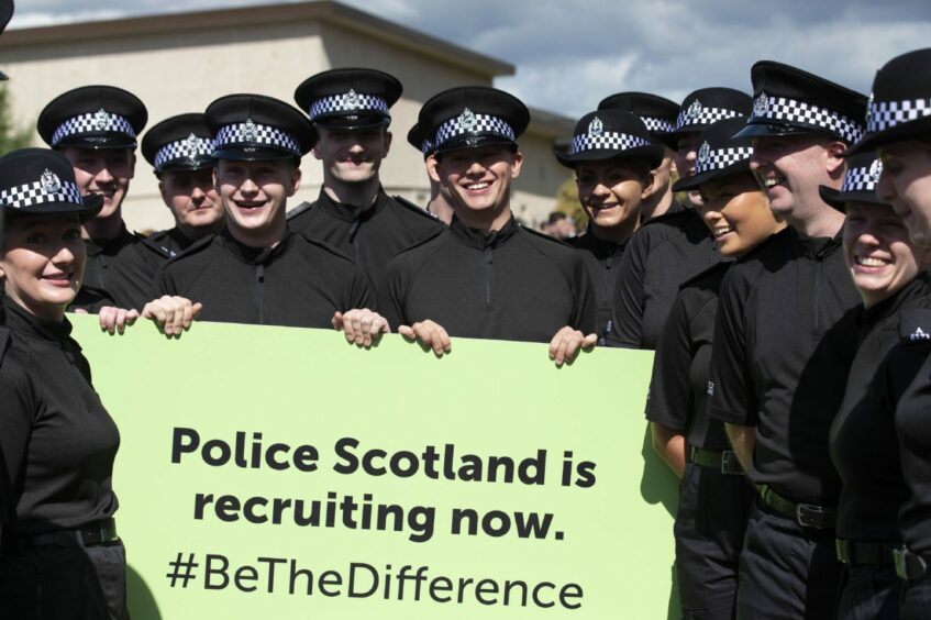 photo shows officers holding a banner which reads 'Police Scotland is recruiting now. #BeTheDifference'