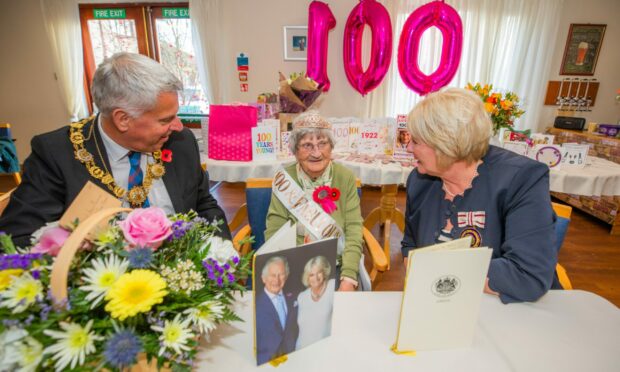 Jean's royal greeting took pride of place as she was visited by Provost of Angus Brian Boyd and Robina Addison, Deputy Lord Lieutenant of Angus. Image: Steve MacDougall / DC Thomson.