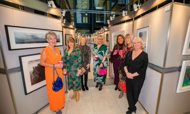 Left to right: Lesley Carroll, Susan Martin, Elaine Donnachie, Alison Henderson, Lina Molinaro, Susan Key and Pam Rodgers visit The Business Beats Cancer art exhibition in the Vision Building. Image: Steve MacDougall / DC Thomson